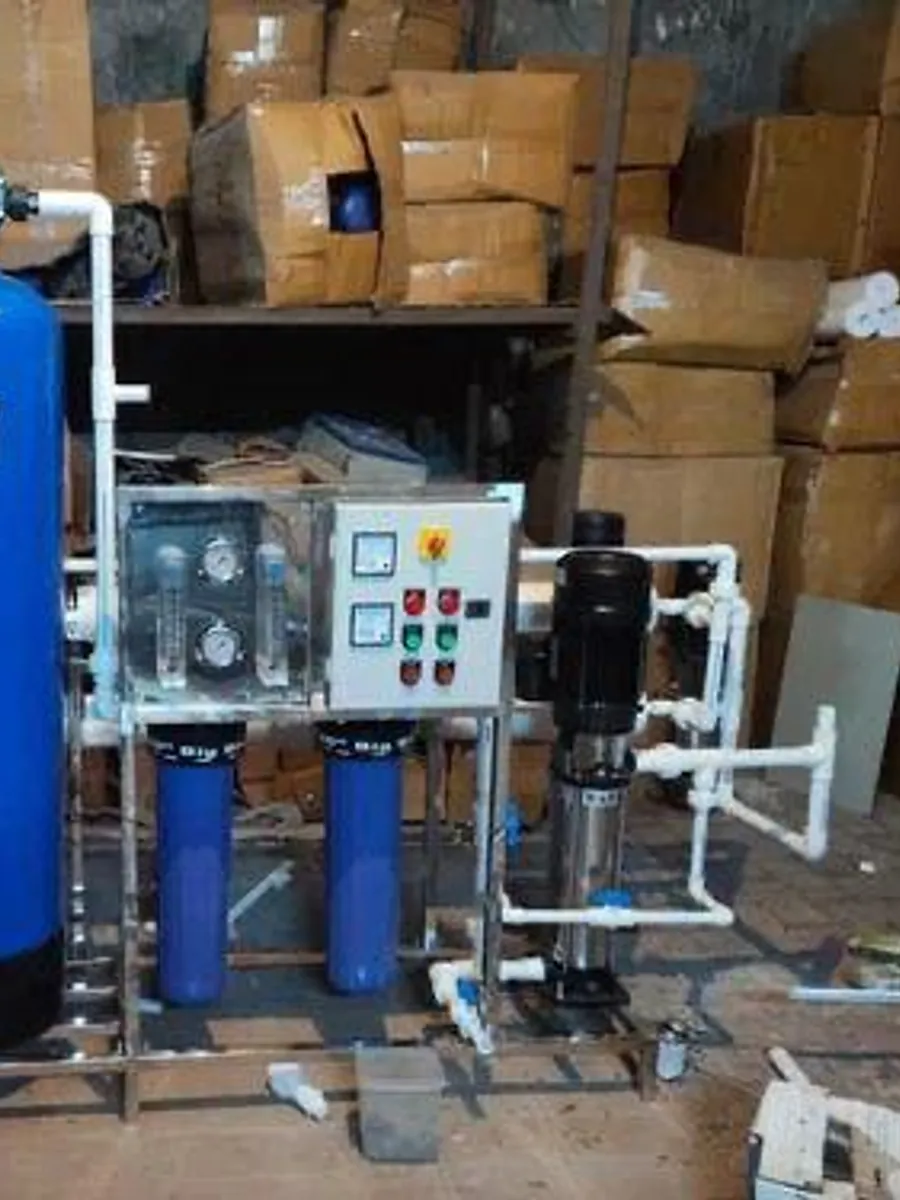 Industrial RO plant in Commercial, Lucknow — Twin FRP vessels, high-pressure pump and control panel assembled.