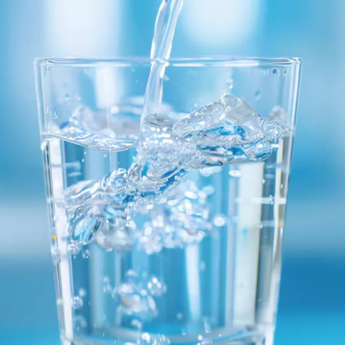Clean purified drinking water being poured into a glass
